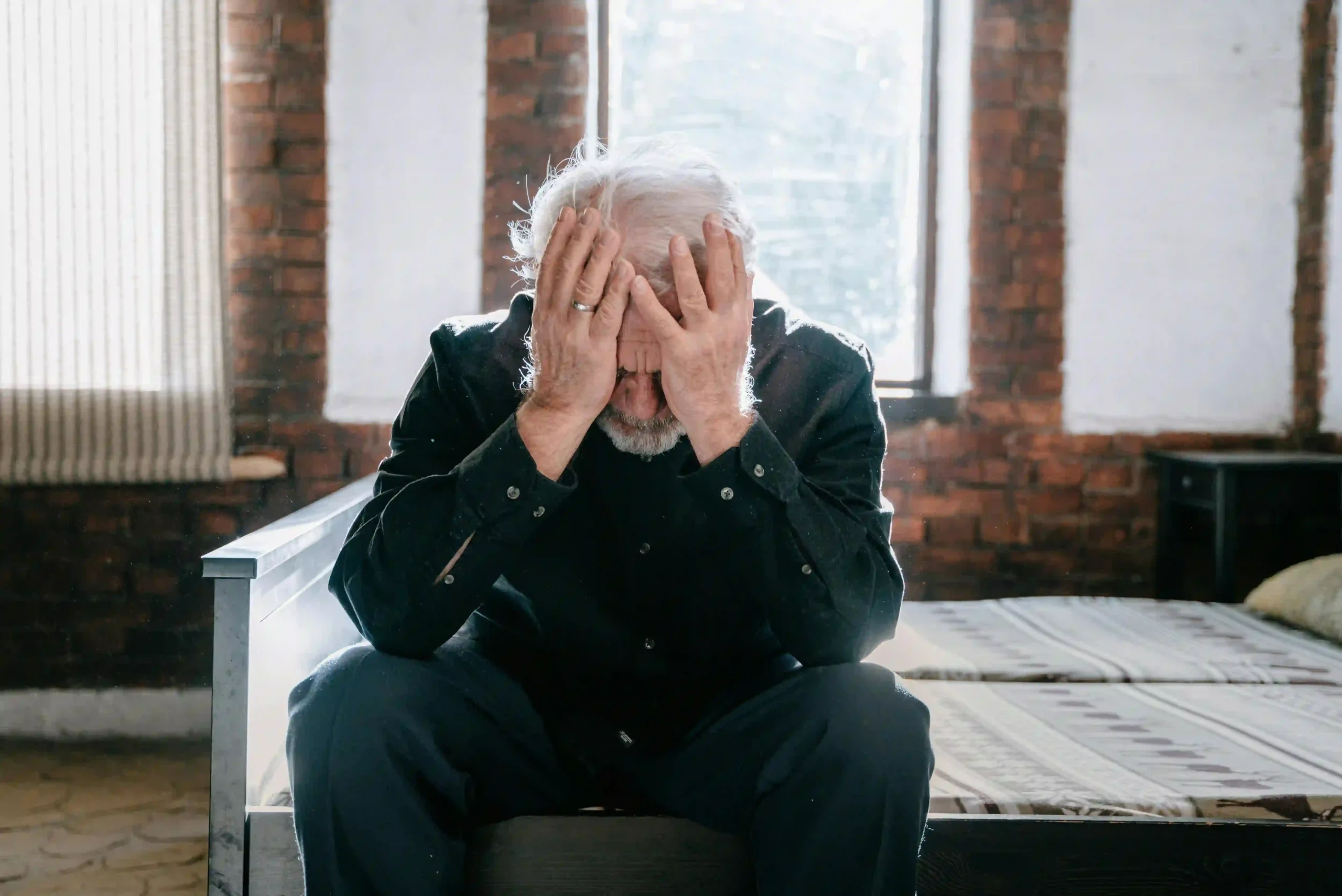 a person with his hands on his face, for a blog about "gastric sleeve surgery ruined my life"