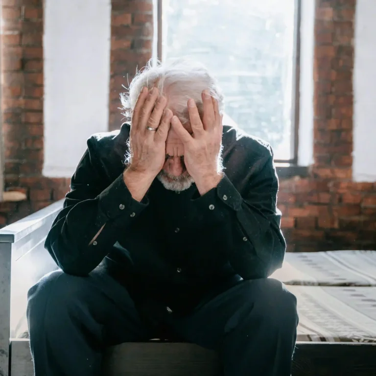 a person with his hands on his face, for a blog about "gastric sleeve surgery ruined my life"